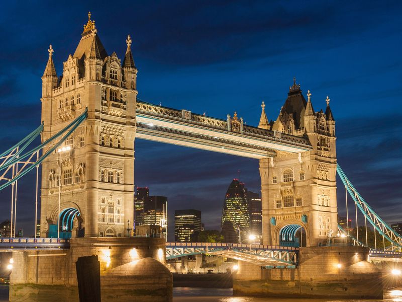 A stunning night view of the illuminated Tower Bridge in London, England.