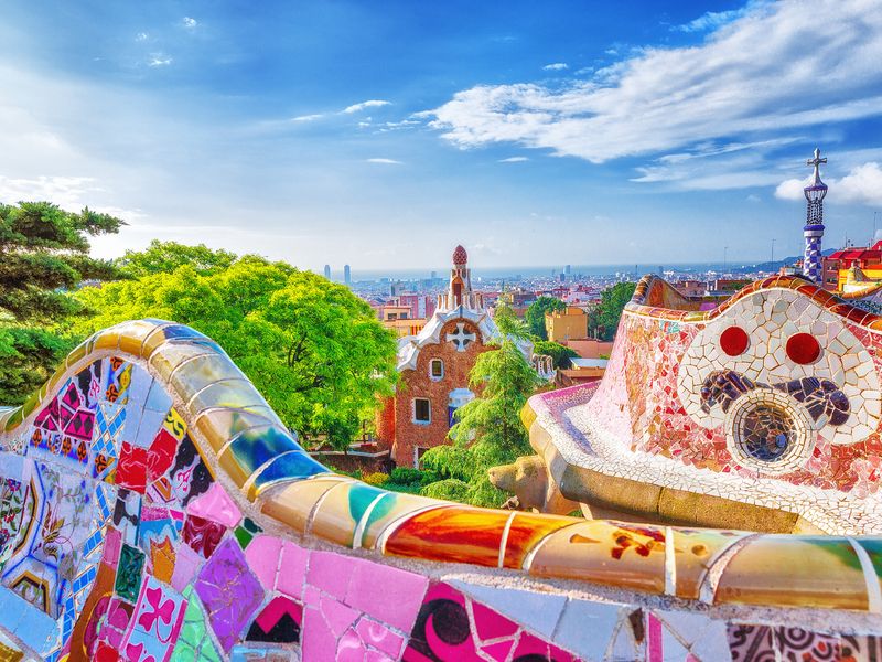 A mosaic bench in Park Güell overlooking Barcelona.