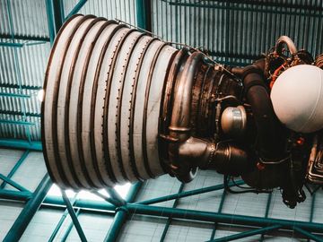 Close-up view of a rocket engine, showcasing its complex machinery and the immense power it possesses.