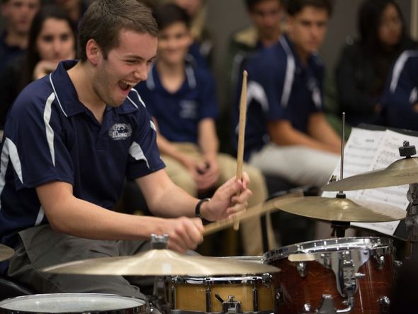 Teenager Boy Playing the Drums