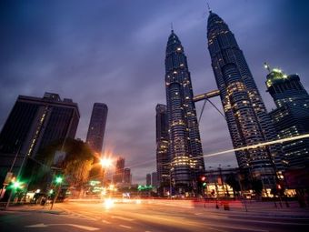 The Petronas Towers in Kuala Lumpur, Malaysia at night.