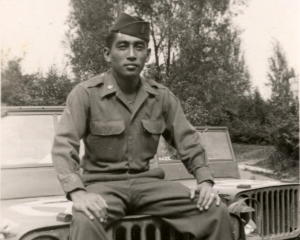 Soldier George A-Doi Posing on Jeep