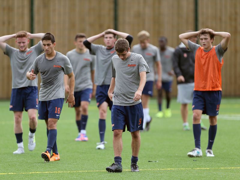 Group of soccer players on a turf field