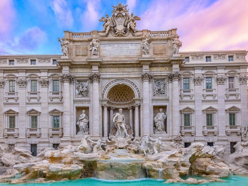 The Trevi Fountain in Rome, Italy at dawn.