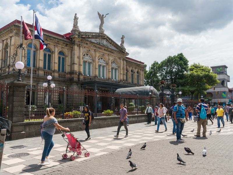 People walk in front of the National Theater of Costa Rica in San Jose, Costa Rica.