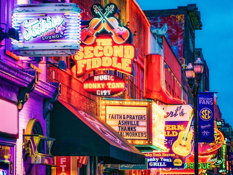 Nashville, Tennessee at dusk with the neon signs all lit up.