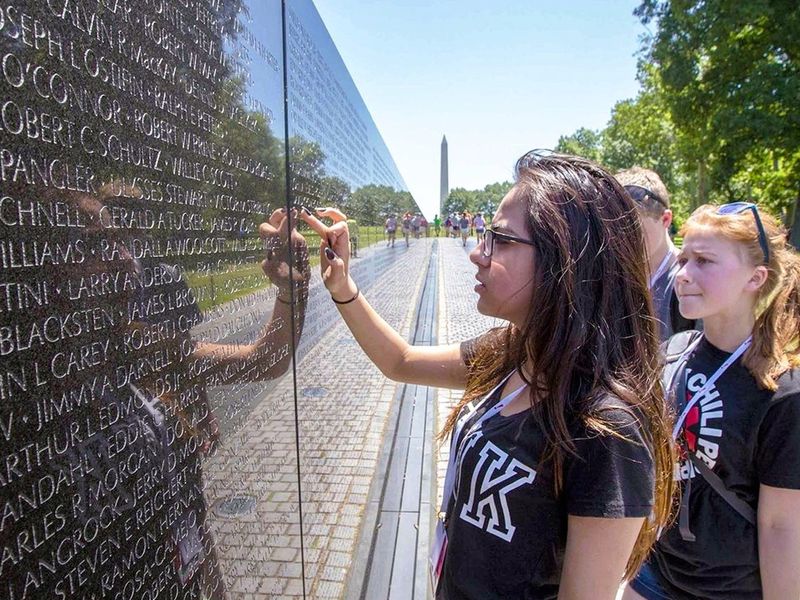 Students visiting the Vietnam Veterans Memorial Wall in Washington, D.C.