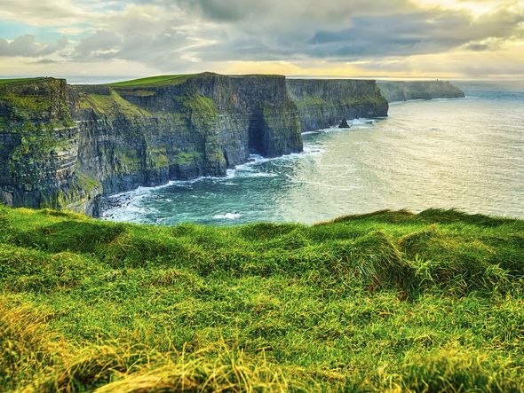 Dramatic cliffs overlooking the ocean at the Cliffs of Moher in Ireland.