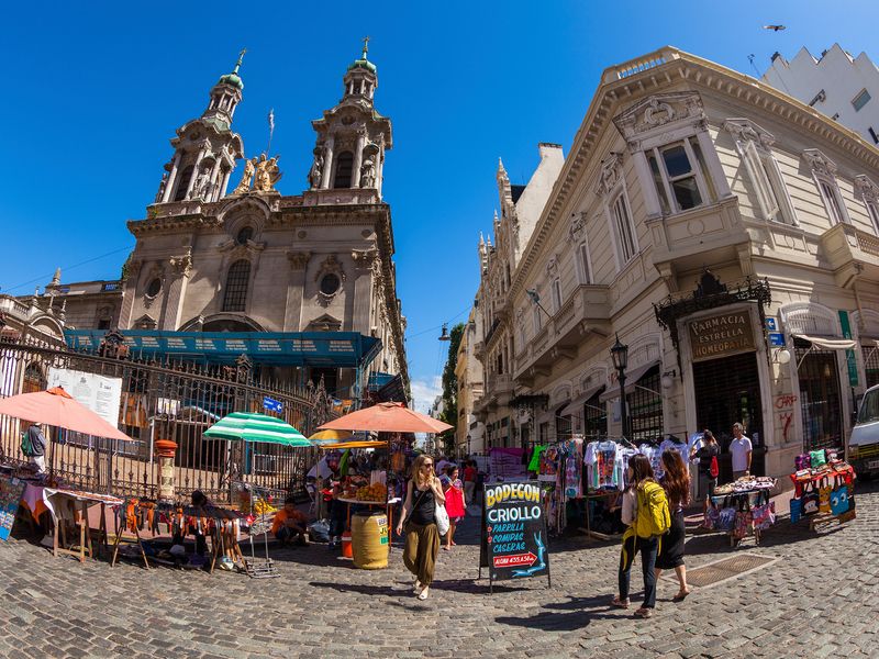 Busy plaza and church in San Telmo, Buenos Aires