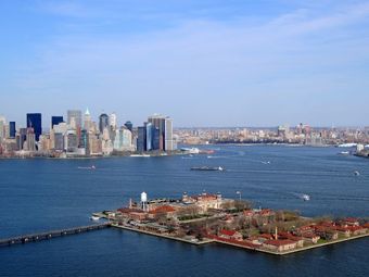 Aerial view of Ellis Island with the New York City skyline in the background