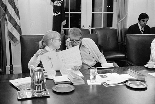 Man and Girl Reviewing Papers