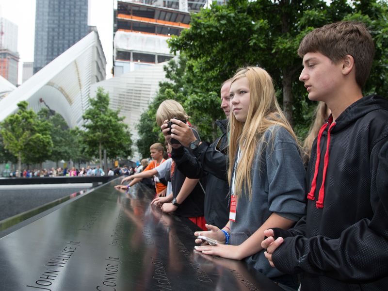 Visitors paying respects at the 9/11 Memorial in New York City.