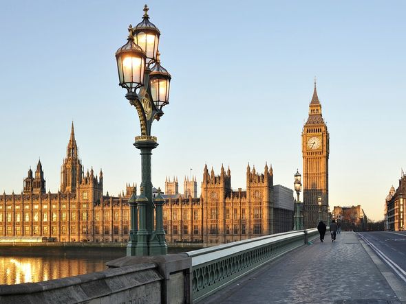 The Houses of Parliament and Big Ben in London, England at sunrise.