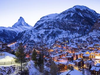 Snowy peaks towering over the village of Zermatt in the Swiss Alps.