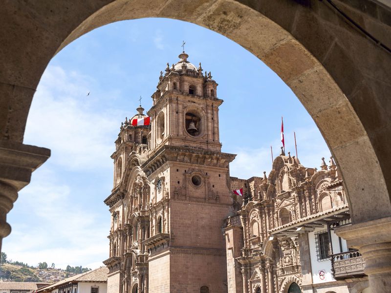 The Cusco Cathedral seen through an archway.