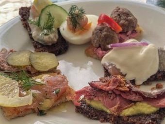 A plate of assorted open-faced sandwiches.