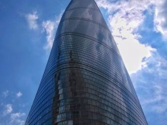 Shanghai Tower soaring into the blue sky