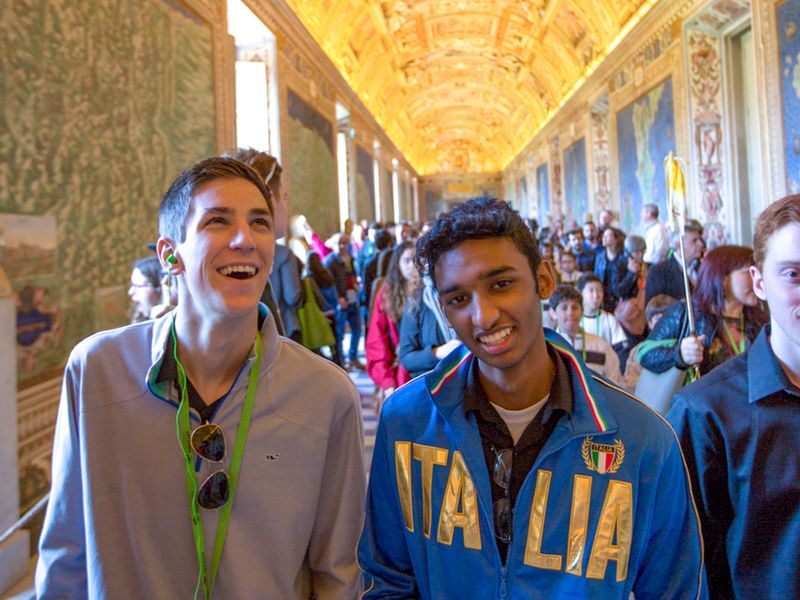 Two teenagers enjoying their visit to the Vatican Museums in Rome.