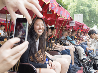 Young Woman Sitting in a Rickshaw Smiling