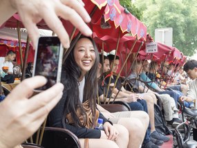 Young Woman Sitting in a Rickshaw Smiling