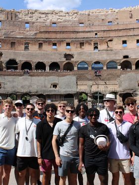 Group of young adults at the Colosseum