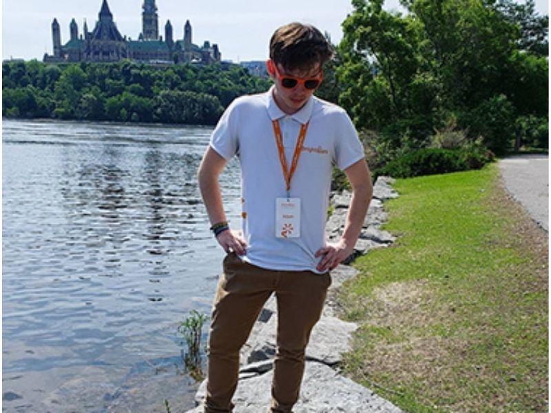 Young Man by the Ottawa River with Parliament Hill