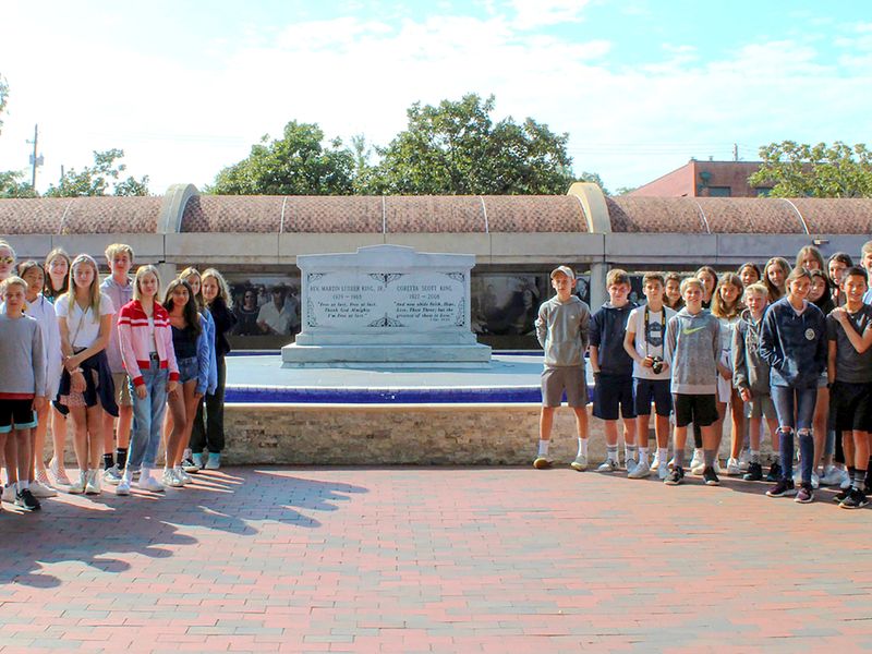 Group of teenagers in front of the tomb of Martin Luther King, Jr.