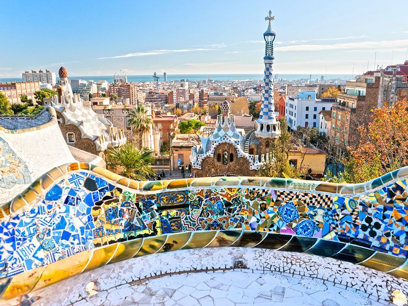 A mosaic bench in Park Güell overlooking Barcelona, Spain.