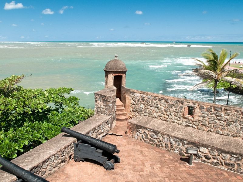 Cannons and fort wall overlooking the ocean at Castillo San Felipe del Morro in San Juan, Puerto Rico