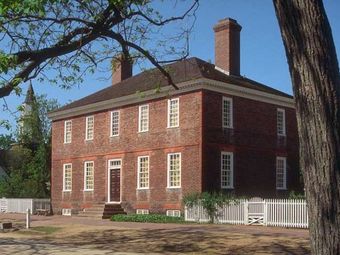 Historic Brick House with White Picket Fence