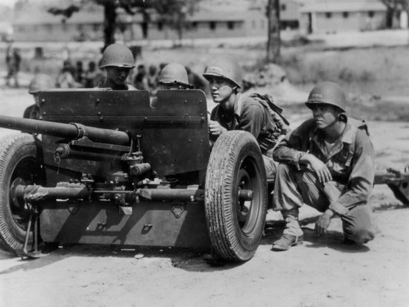 World War II soldiers from the 442nd Regimental Combat Team during training with a 57mm anti-tank gun.