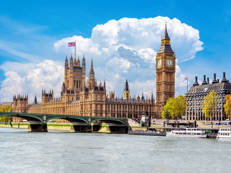 The Houses of Parliament and Big Ben in London, England, on a sunny day.