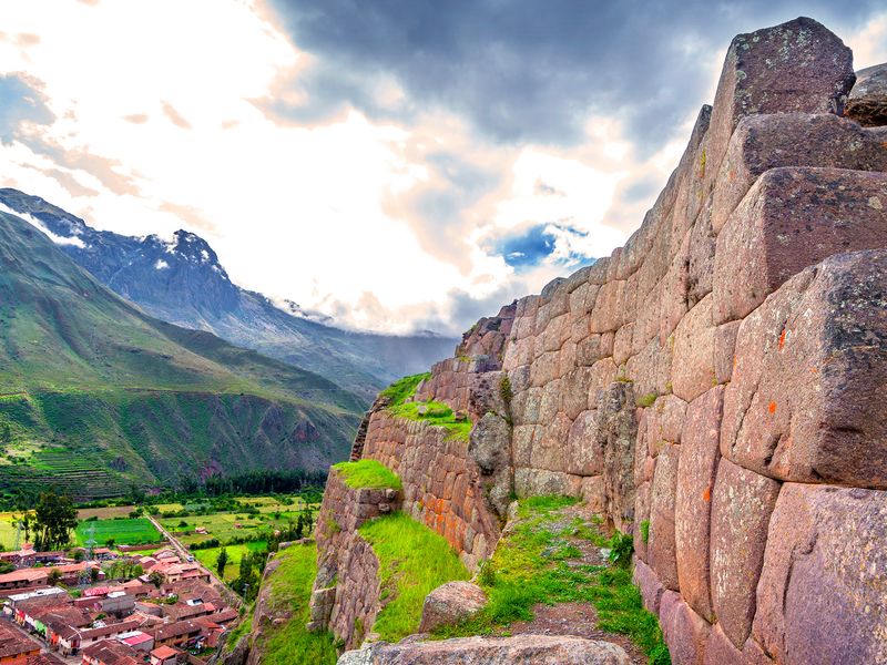 The Ollantaytambo ruins are located in the Sacred Valley of Peru. They are a popular tourist destination and are known for their impressive stonework.