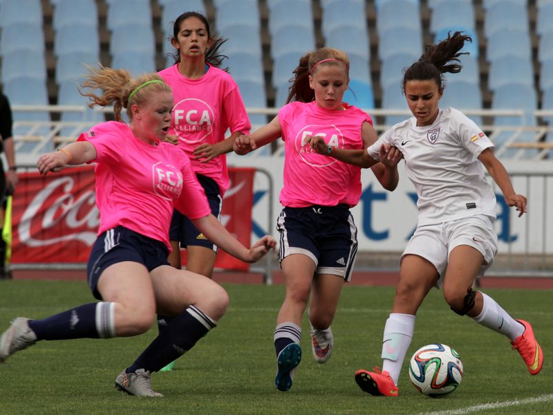 Teenage girls playing soccer