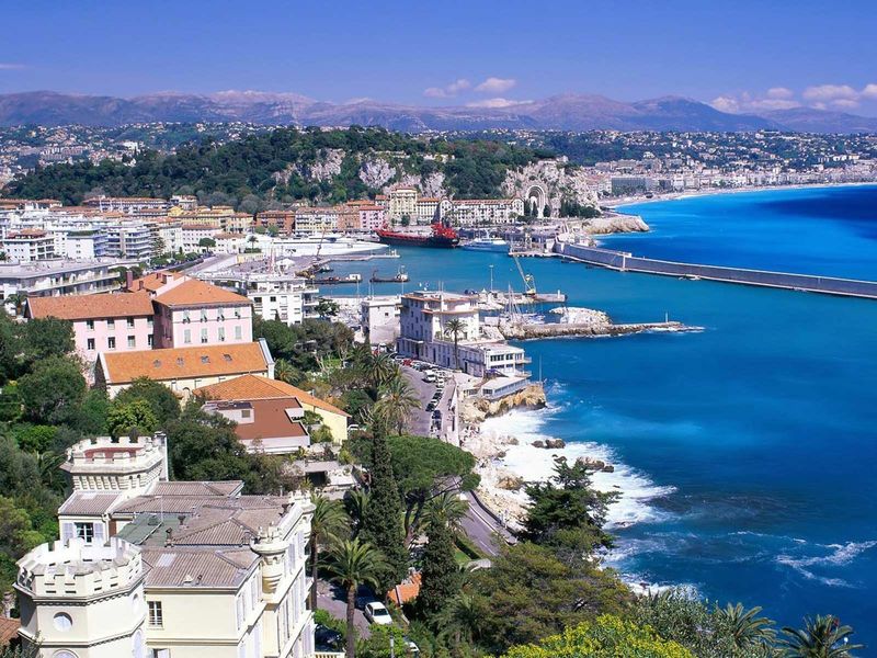 Aerial view of Nice, France, with the Mediterranean Sea, cityscape, and coastline.