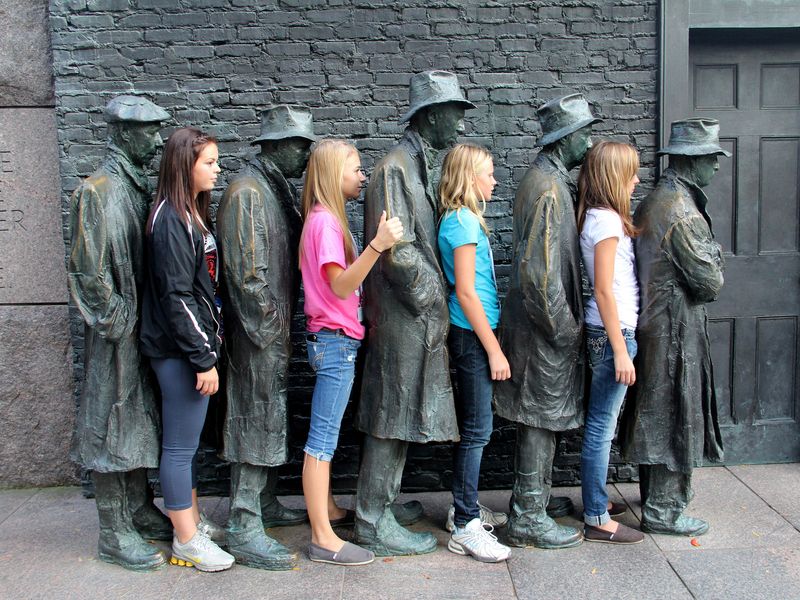 Students posing in the breadline at the Franklin Delano Roosevelt Memorial