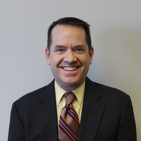 Headshot of smiling adult male