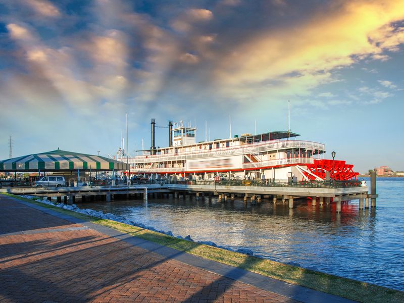 A historic riverboat docked on the Mississippi River in New Orleans.