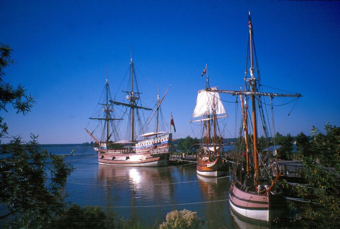 Replicas of the Susan Constant, Godspeed, and Discovery ships docked at Jamestown Settlement.