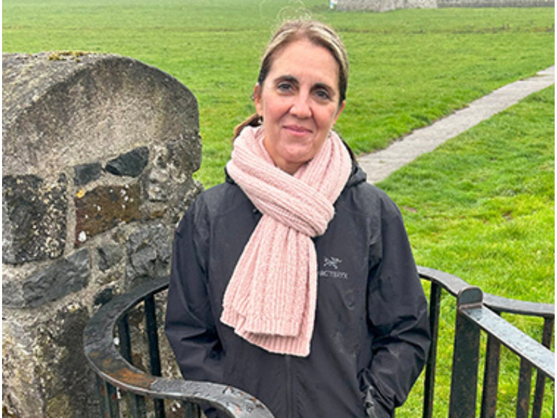 Woman in Pink Scarf by Stone Wall Tour Director
