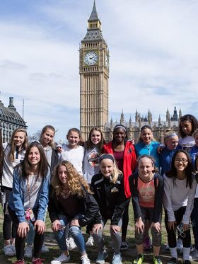 Group of teenage girls in front of Big Ben in London