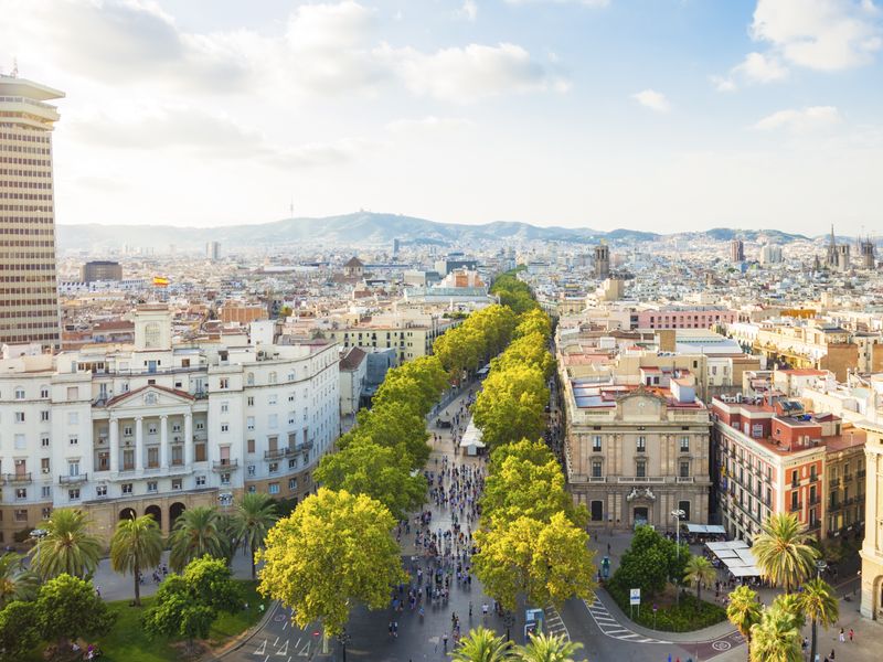 A high-angle view of Barcelona's Passeig de Gràcia, showcasing the boulevard's vibrant atmosphere and the city's unique architecture.