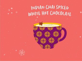 A purple mug with a gold pattern filled with Indian Chai Spiced White Hot Chocolate, topped with a star anise and spices.