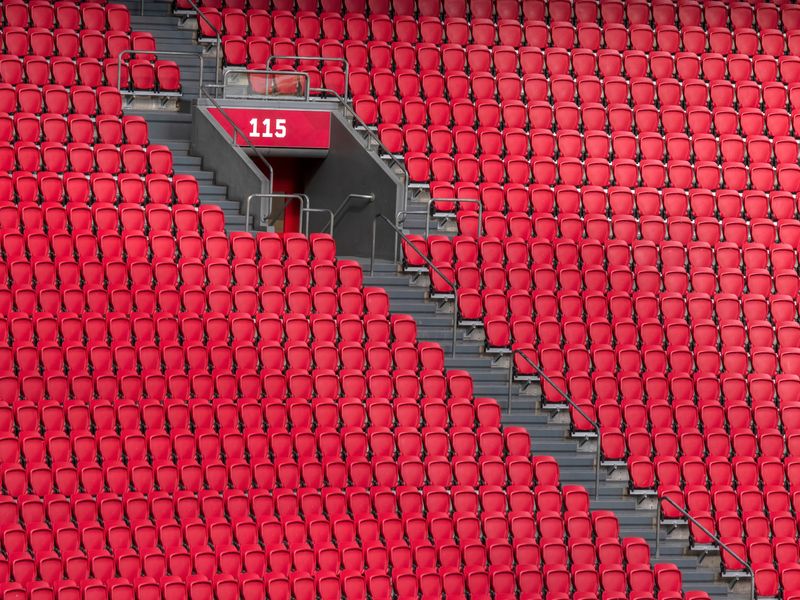 Empty red stadium seats.